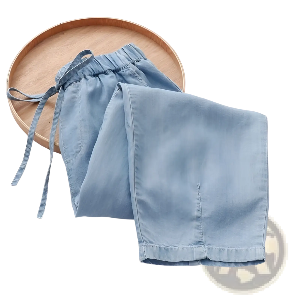 Light blue high waisted harem jeans denim shorts with elastic waistband and drawstring for comfortable wear