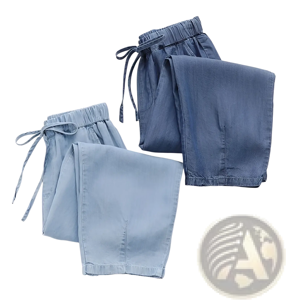A pair of light blue high waisted harem jeans denim shorts with elastic waistbands and drawstrings