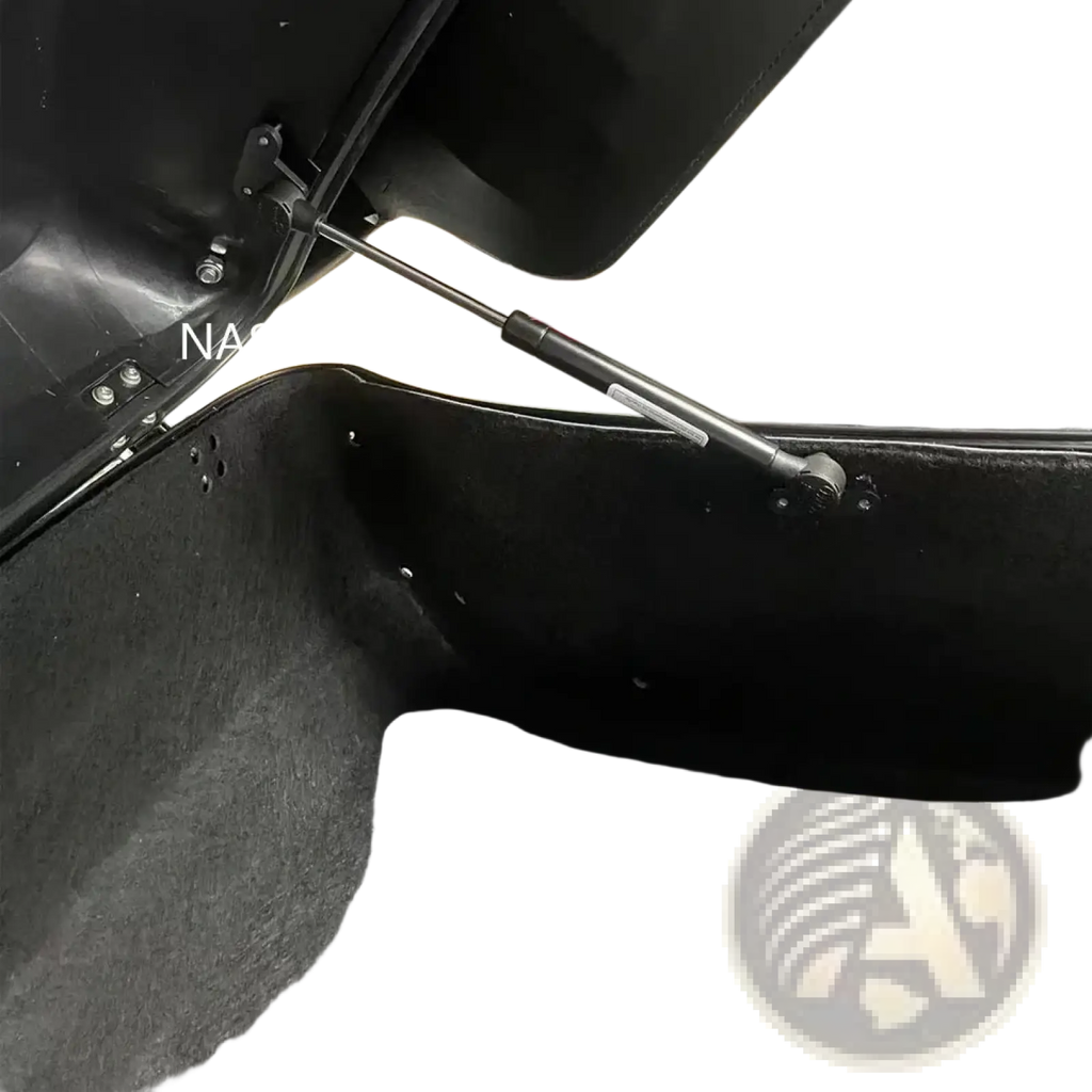 Back side of a black Harley Touring trunk support rod with textured interior lining and metal gas strut for 2014-2023 models