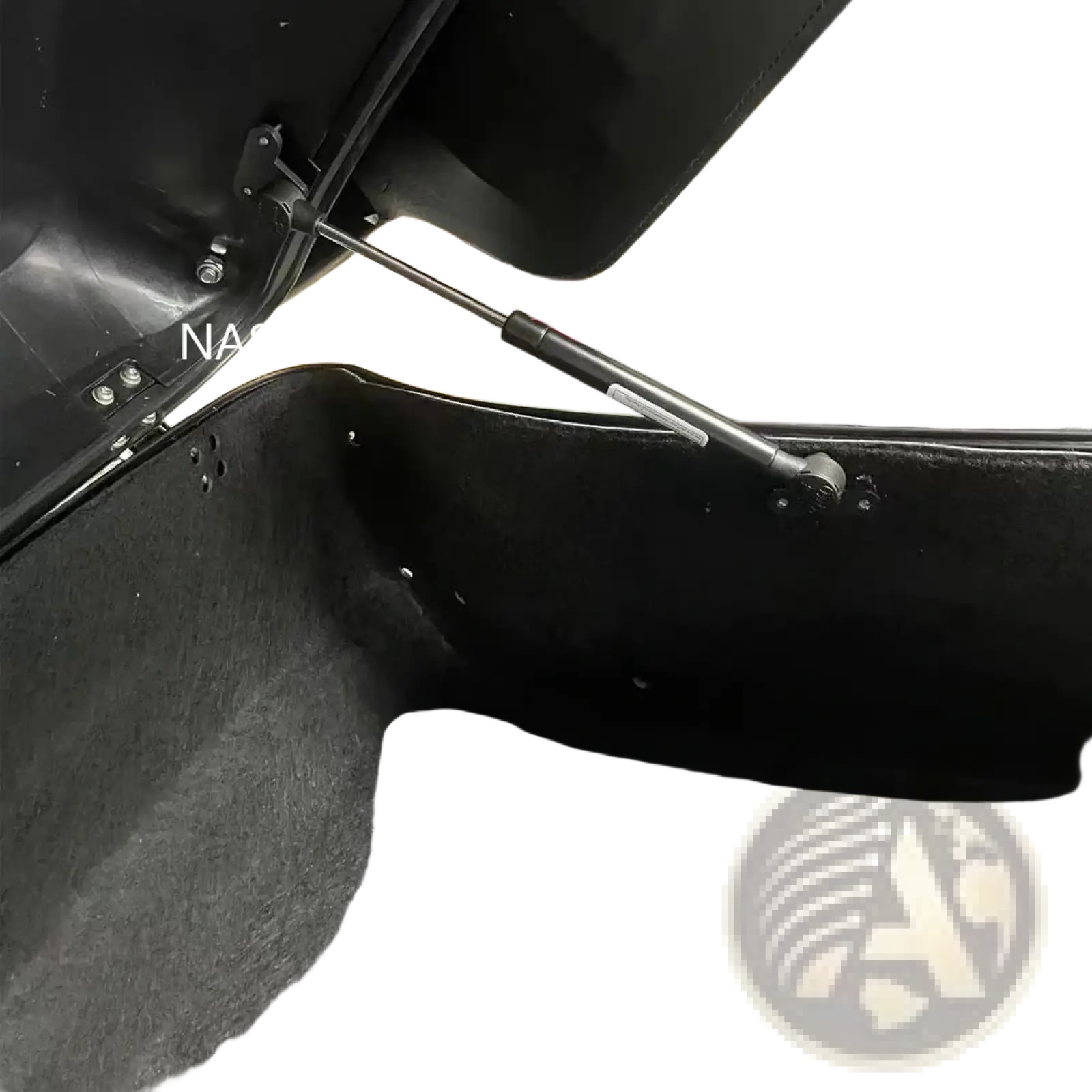 Back side of a black Harley Touring trunk support rod with textured interior lining and metal gas strut for 2014-2023 models