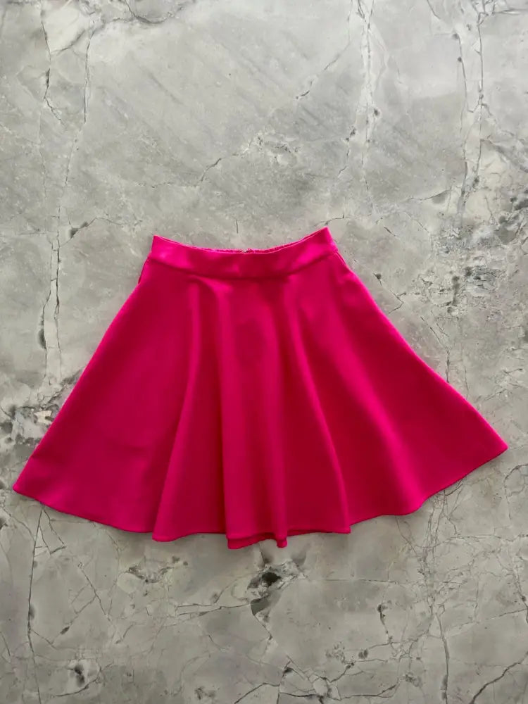 Harper fuchsia satin pleated skater skirt with pockets featuring a vibrant color and smooth satin finish with elastic waistband