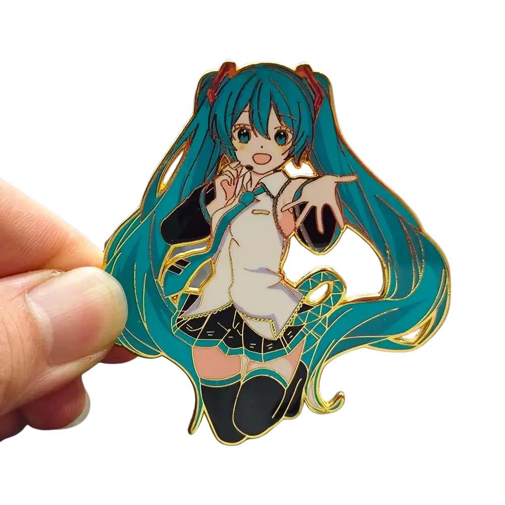 A vibrant teal and gold metal enamel pin featuring hatsune miku in her iconic outfit for anime fans