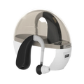 Black and white wireless hearing aid with noise reduction design nestled in a matching charging case