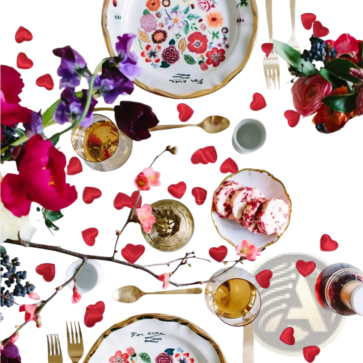 A white ceramic plate with a gold rim and colorful floral hand-painted designs for wedding party decor