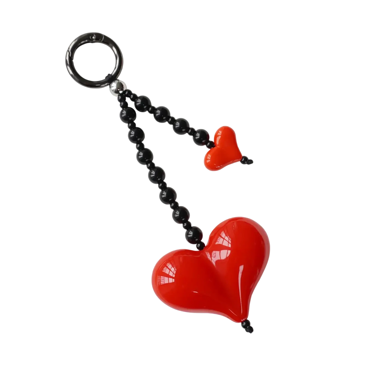 A glossy red heart keychain with a smaller pendant on black beads and a silver-toned ring for bag charm use