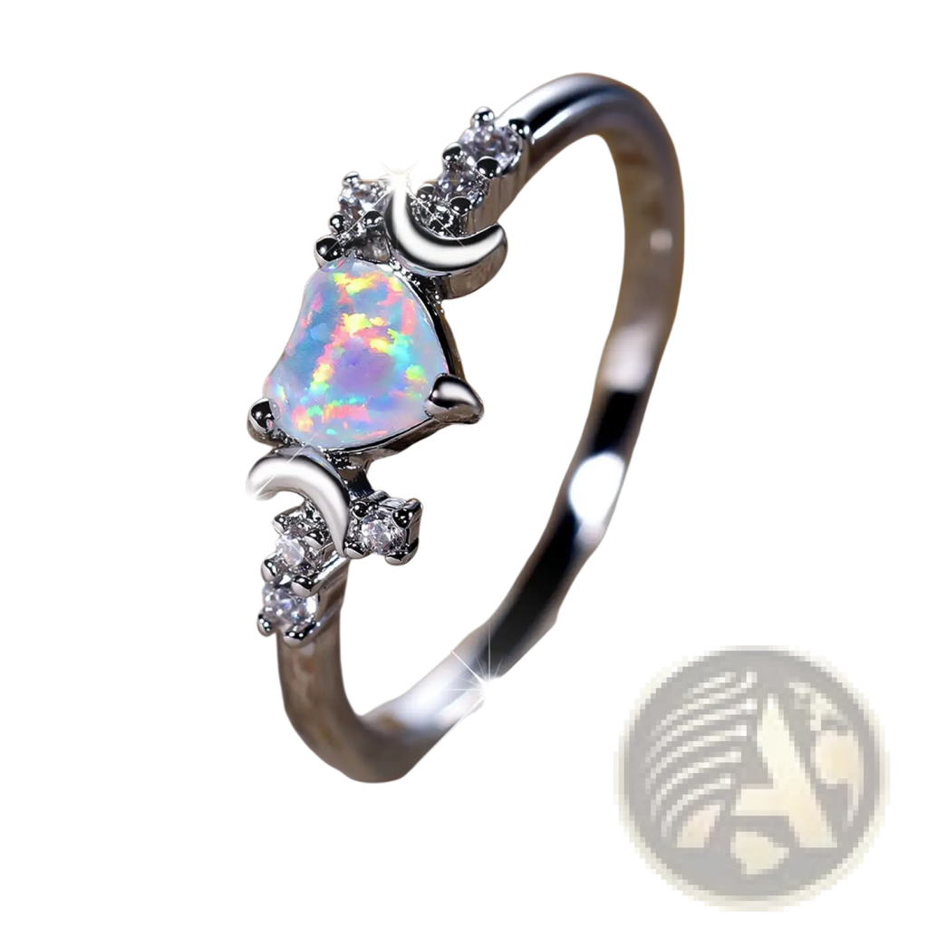 A delicate silver heart opal crescent moon ring with iridescent stone and sparkling diamond accents