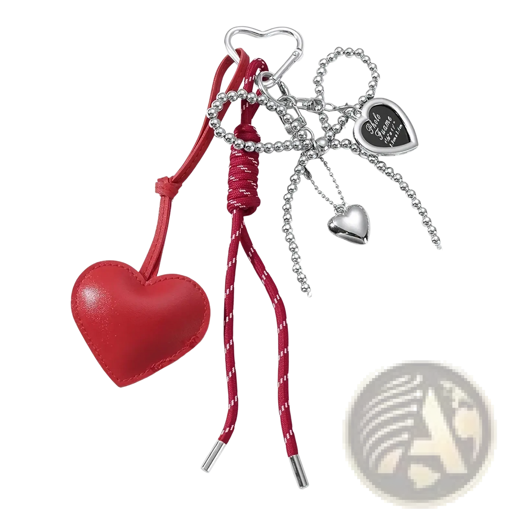 Red heart-shaped leather keychain with silver metal accents and beaded chain for bag accessory use
