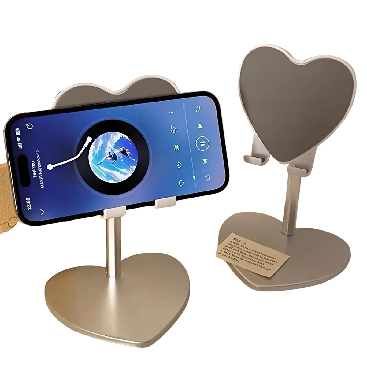 Silver heart-shaped adjustable desktop phone stand holding a smartphone for convenient hands-free use