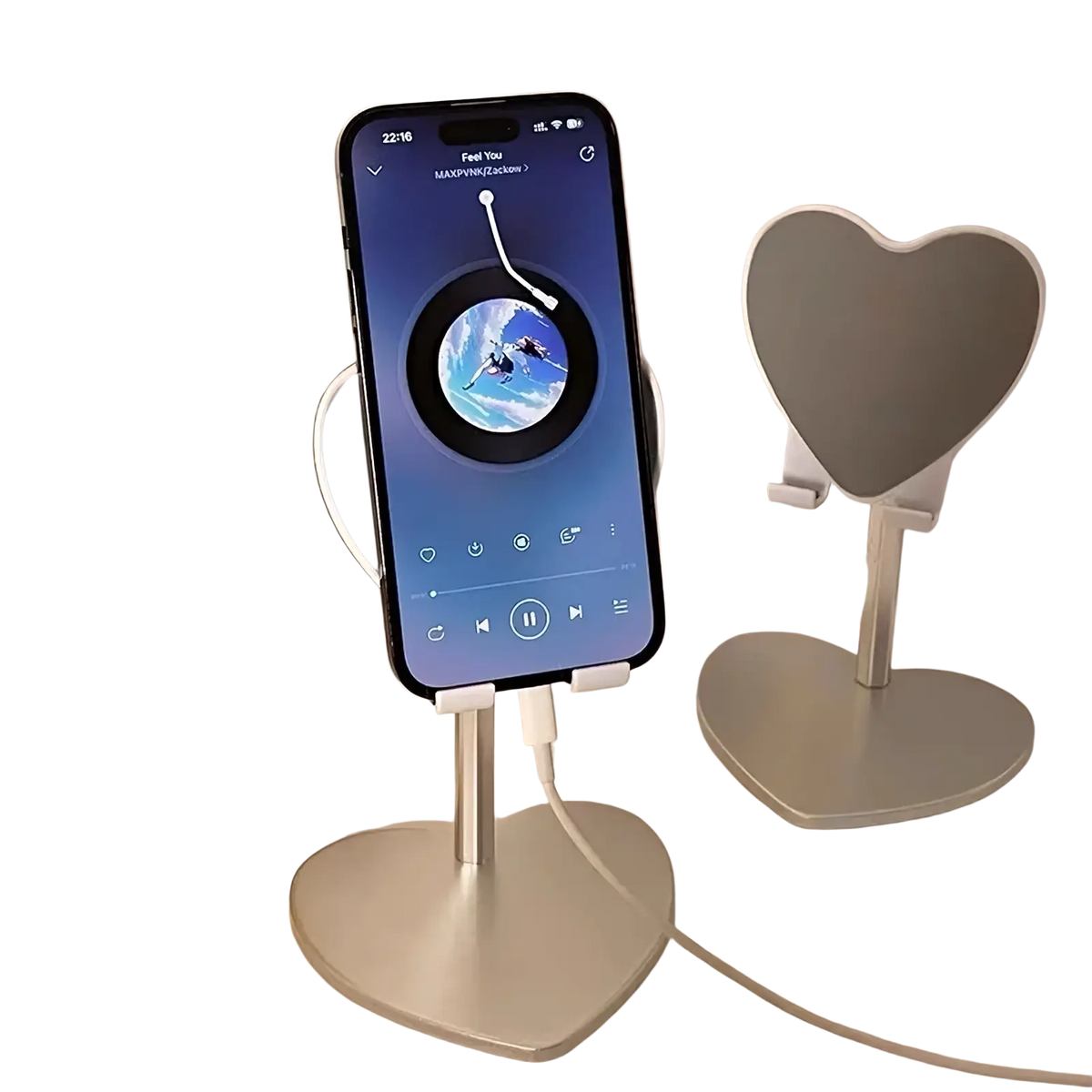 Silver heart-shaped adjustable desktop phone stand with sleek minimalist design holding an iPhone