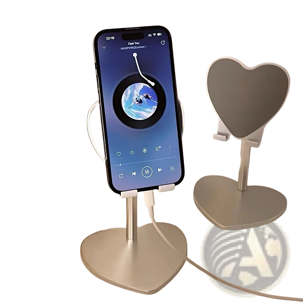 Silver heart-shaped adjustable desktop phone stand with sleek minimalist design holding an iPhone