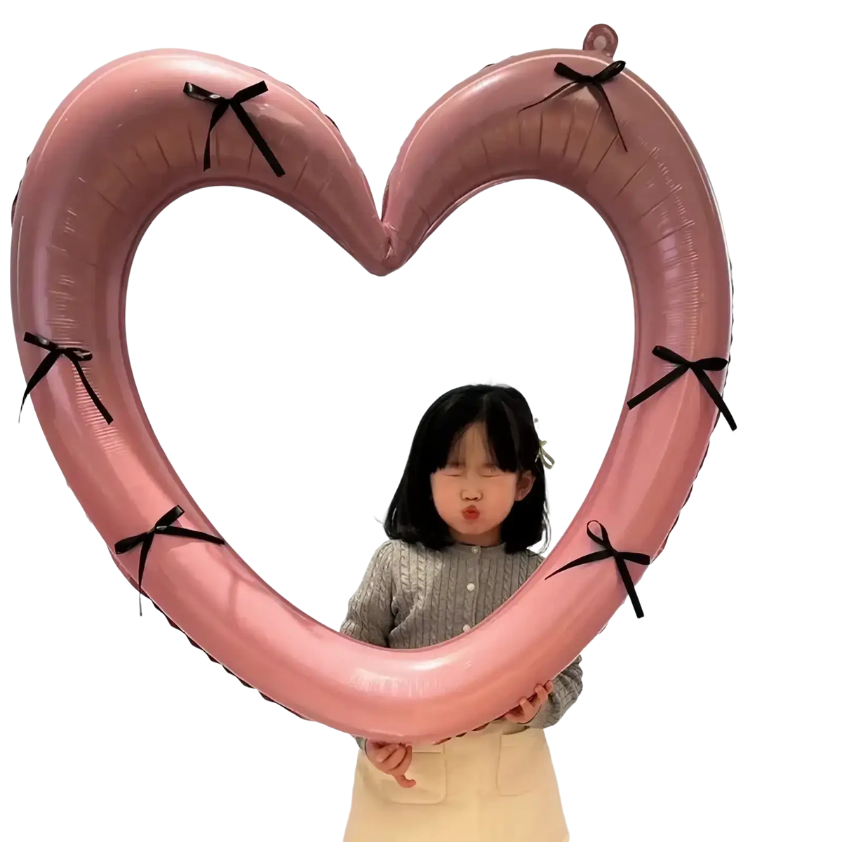 A pink heart photo frame balloon with black ribbon ties designed for party decoration and photo display