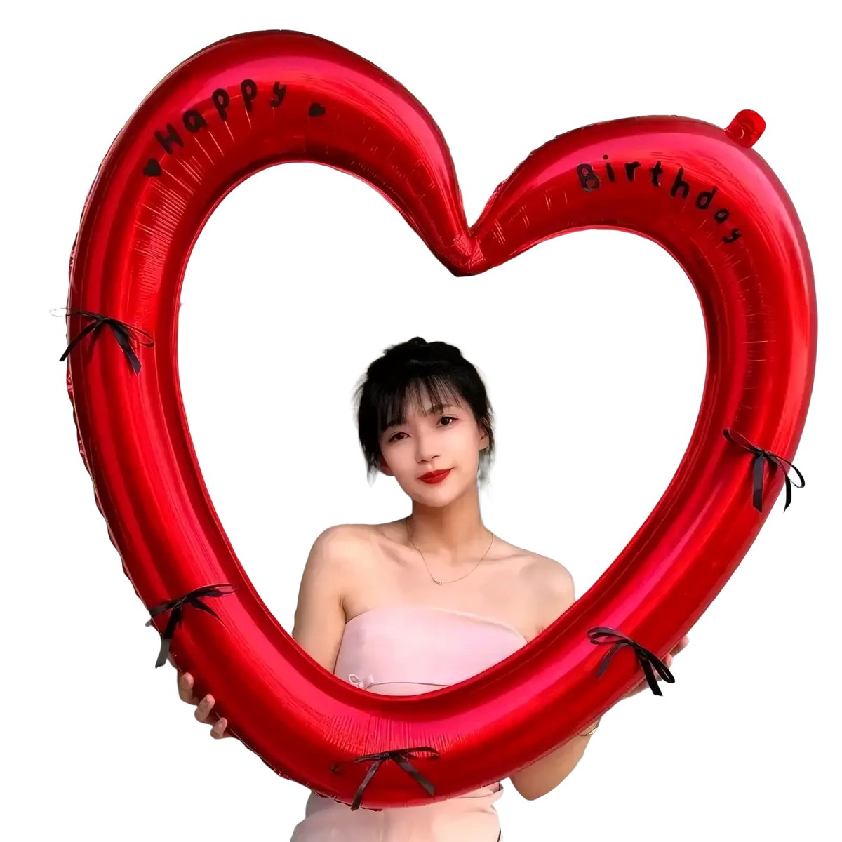 A shiny red heart photo frame balloon with happy birthday print and black ribbon ties for party decoration
