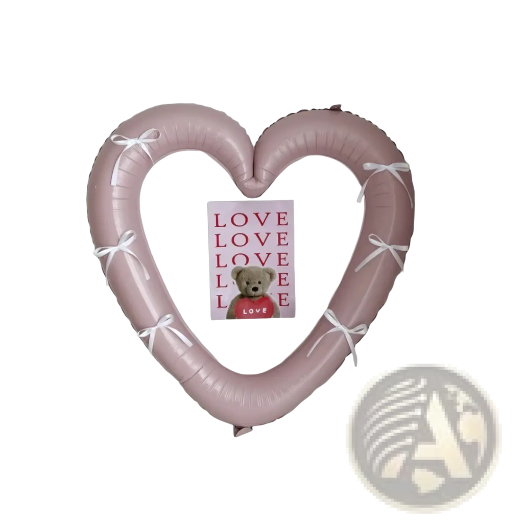A soft pink heart photo frame foil balloon wreath 40 inch adorned with delicate white ribbons