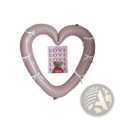 A soft pink heart photo frame foil balloon wreath 40 inch adorned with delicate white ribbons