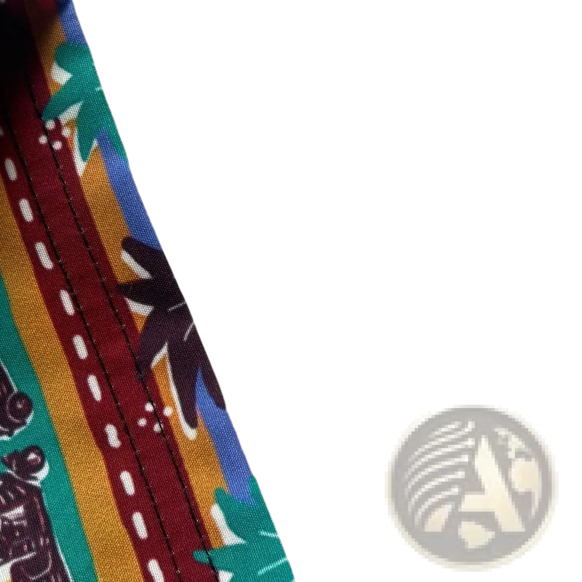 Heart print casual short sleeve button down shirt with vibrant tropical fabric in red yellow and teal featuring palm trees and roads