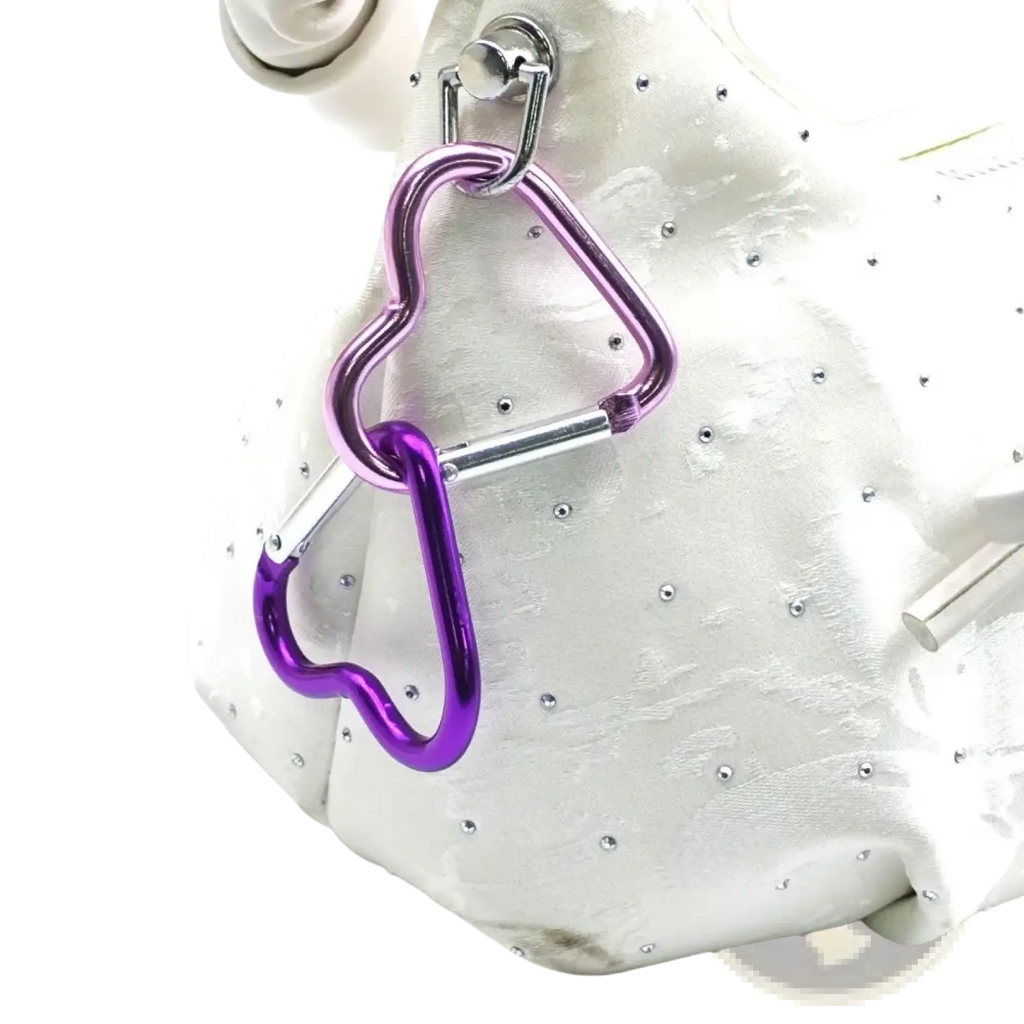 Heart shaped carabiner keychain set featuring linked purple and silver metal heart shaped carabiners