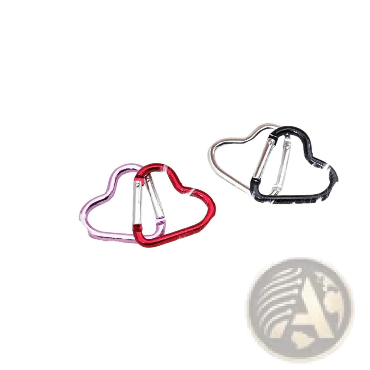 Heart shaped carabiner keychain set with pink red and black metallic finishes on a white fluffy surface