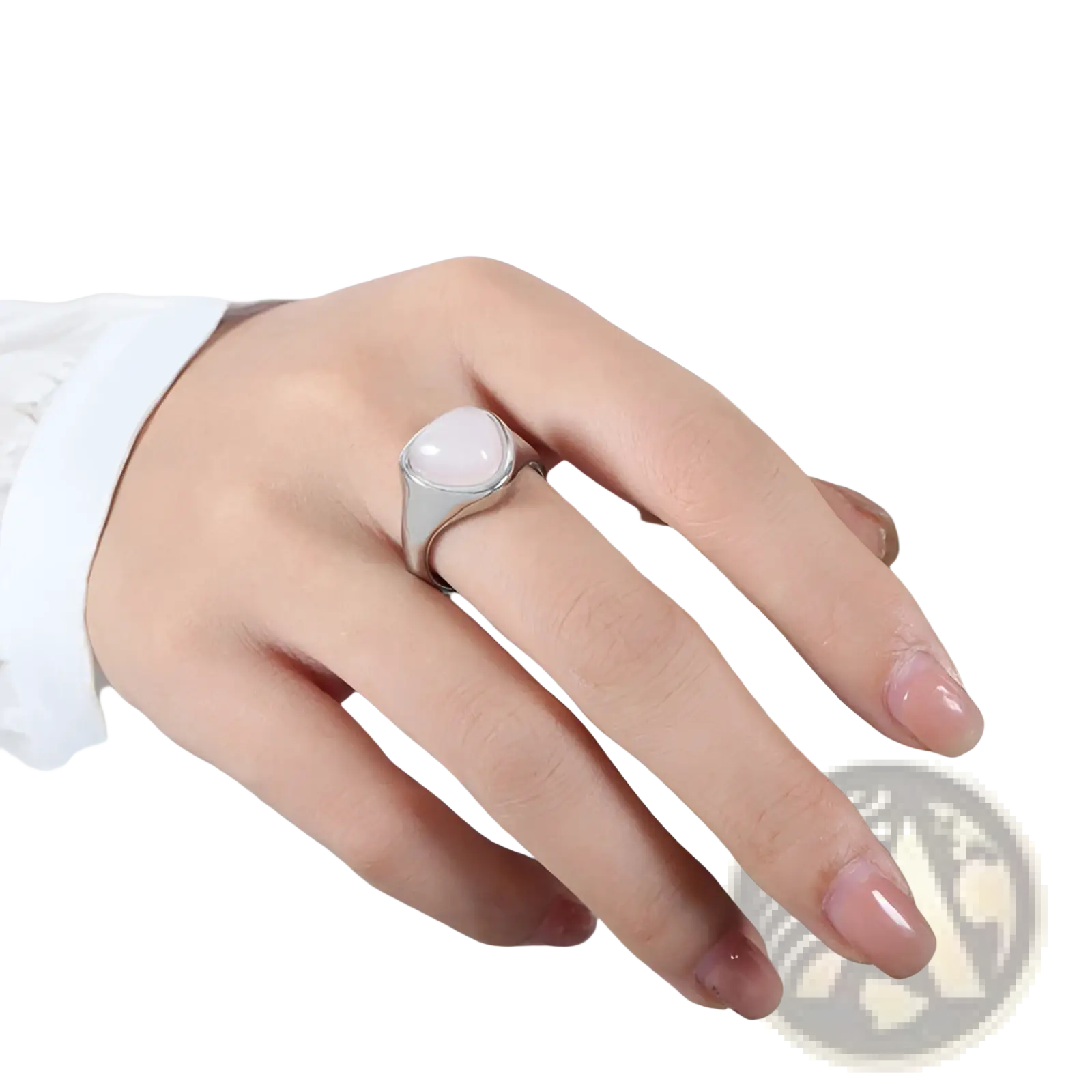 A sleek silver titanium steel signet ring with a smooth oval pink stone in a minimalist band design