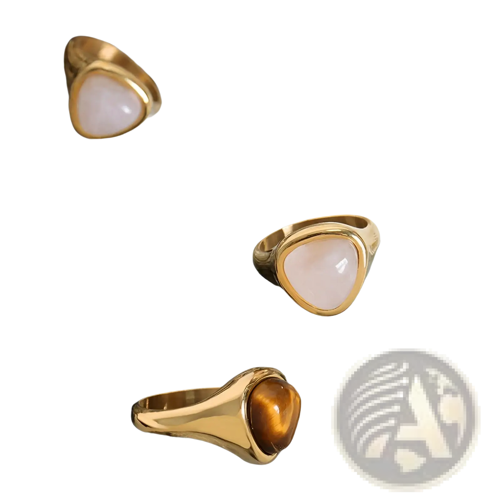 Gold-toned titanium steel signet rings with heart shaped smooth pink rose quartz and golden tiger’s eye stones