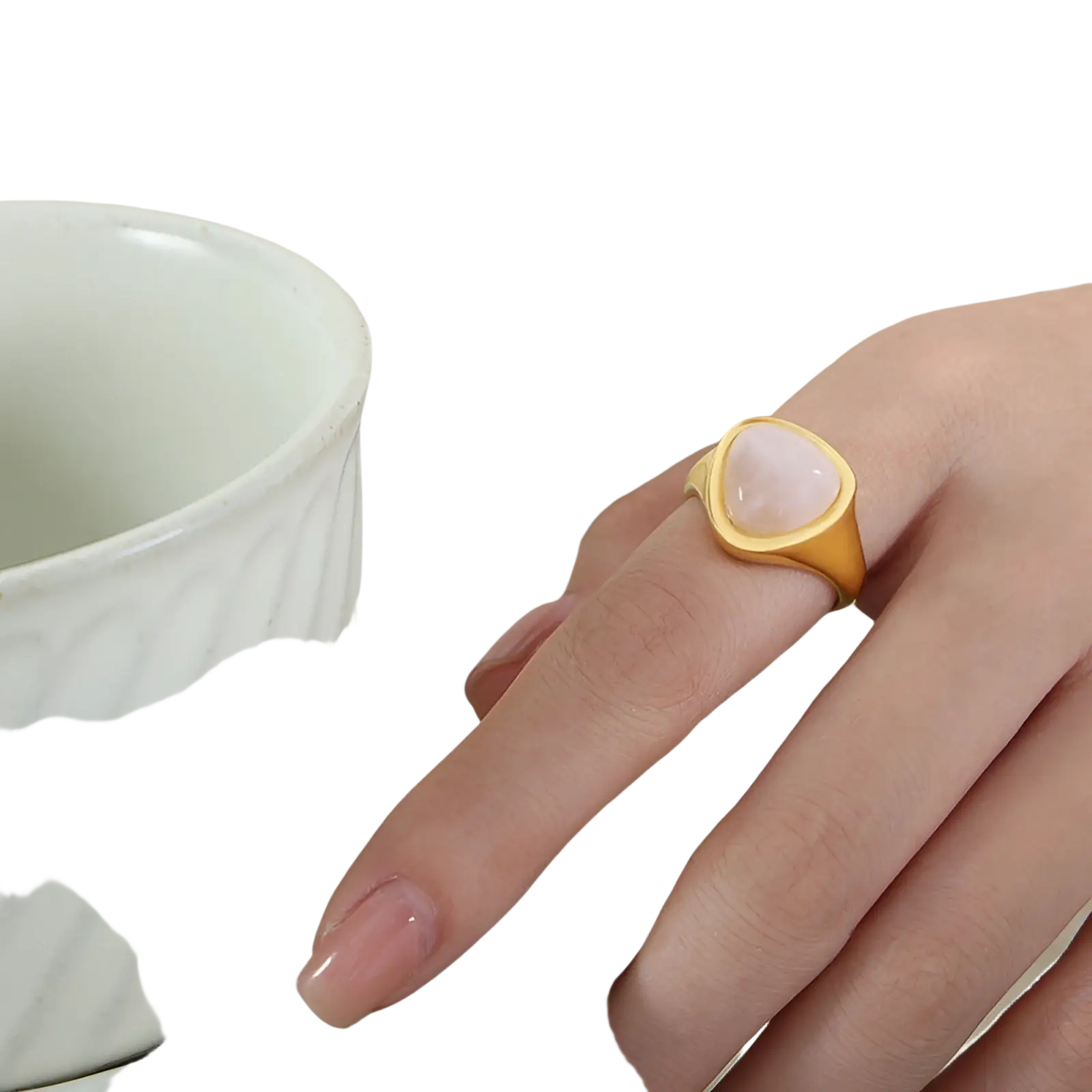 Gold ring with a soft pink heart-shaped natural stone set in a sleek titanium steel signet band