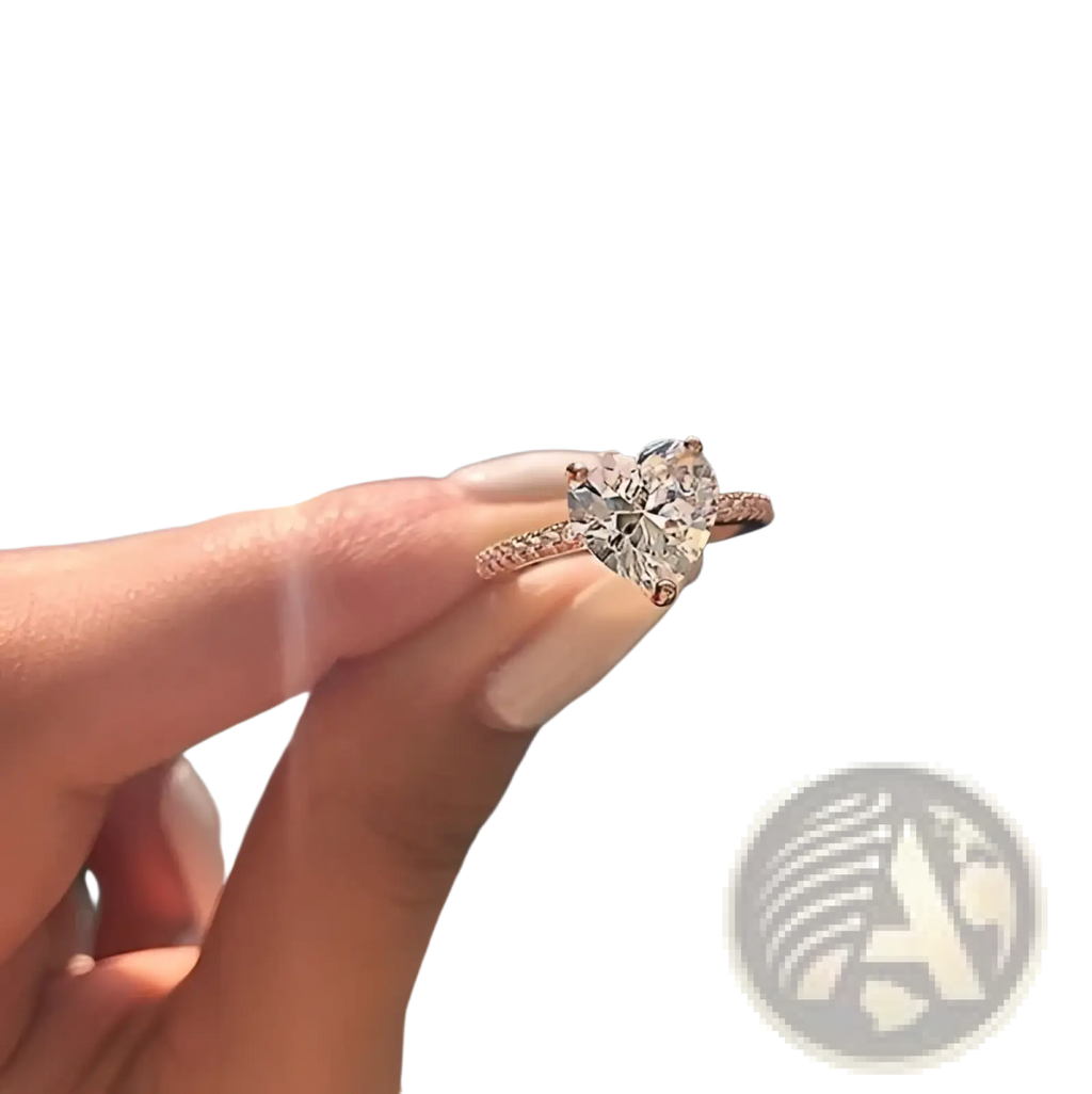 A rose gold heart shaped diamond ring with pave setting in white gold plating for engagement