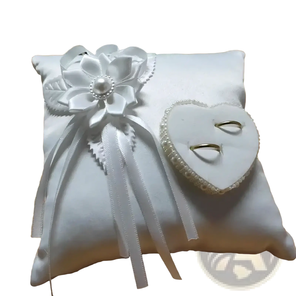 Heart wedding ring pillow in white satin with large ribbon flower pearl embellishment and heart-shaped pearl ring holder