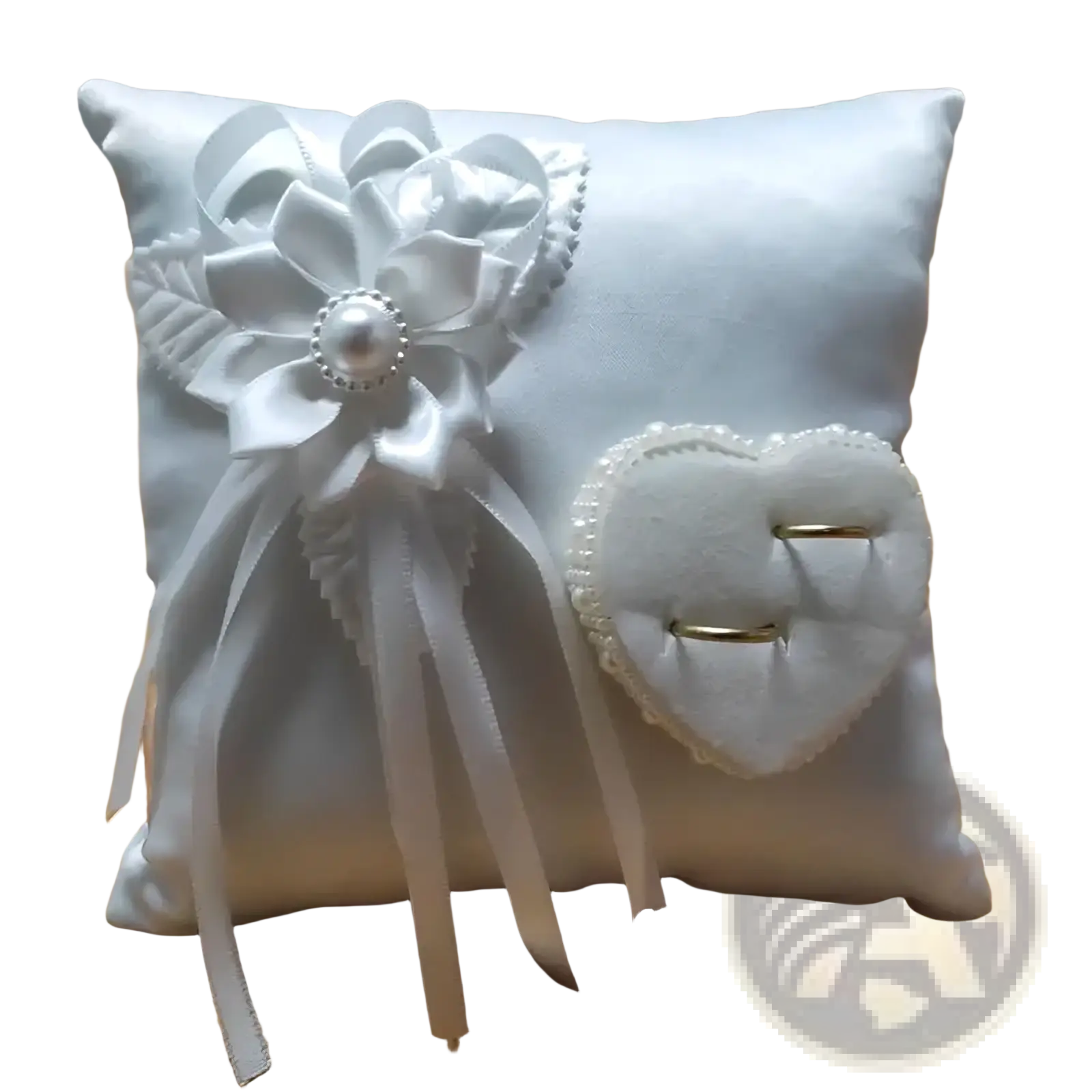 White satin heart wedding ring pillow with large floral bow and velvet heart-shaped ring holder for ceremony