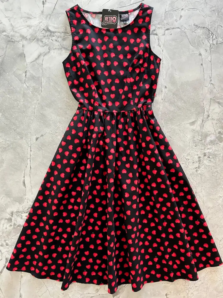 Black sleeveless vintage style cotton midi dress with flared skirt red heart pattern and fitted waistband with pockets