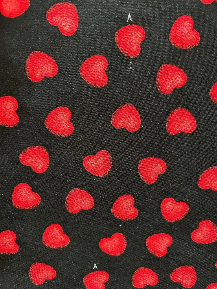 Black cotton midi dress with pockets featuring a vintage style vibrant red hearts print on fabric