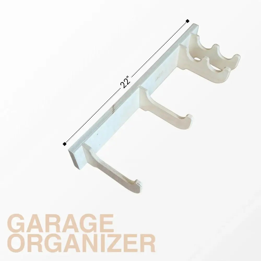 White plastic curved hooks attached to birch plywood heavy duty garage wall tool rack for organized tool storage