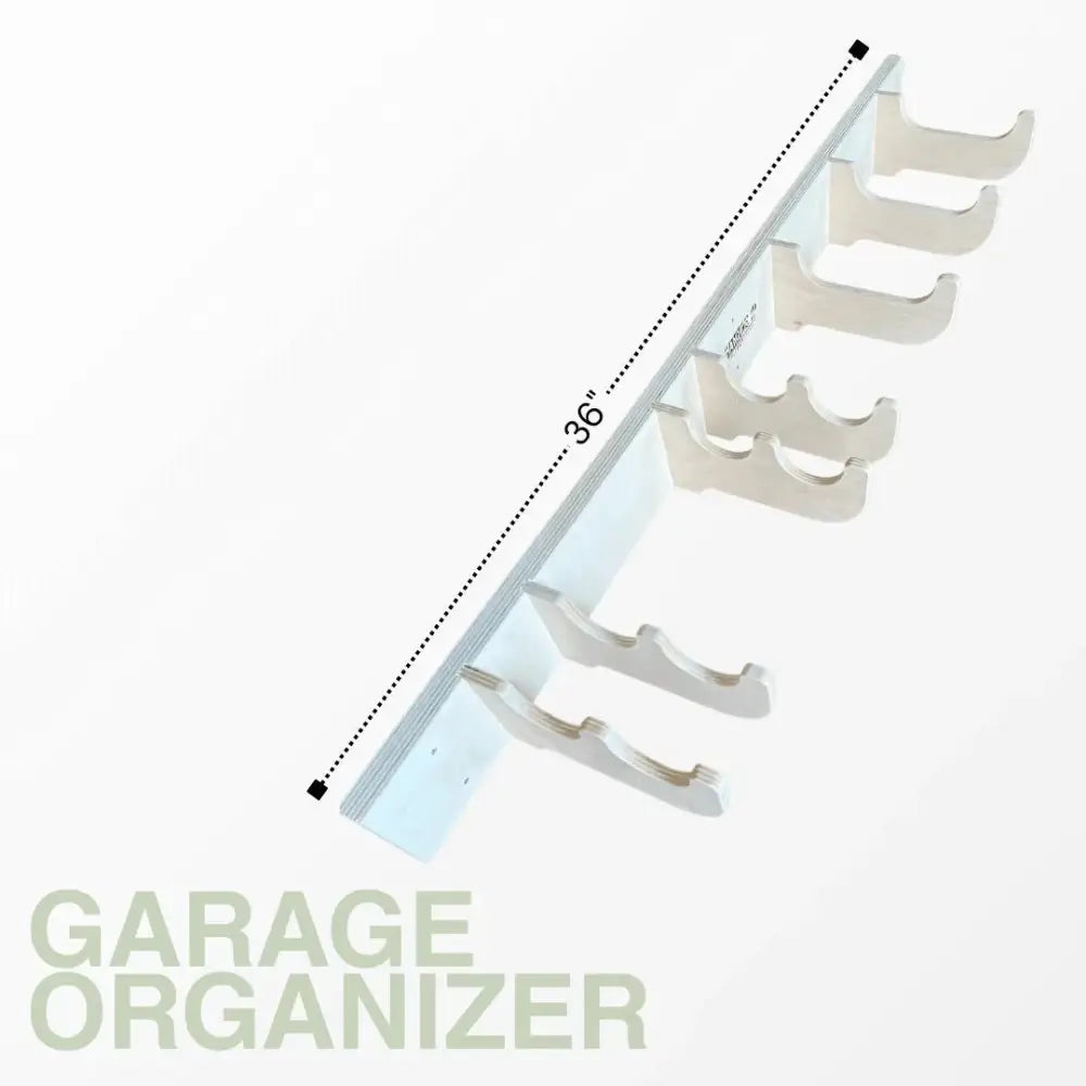 White plastic garage organizer with five hooks on birch plywood heavy duty garage wall tool rack
