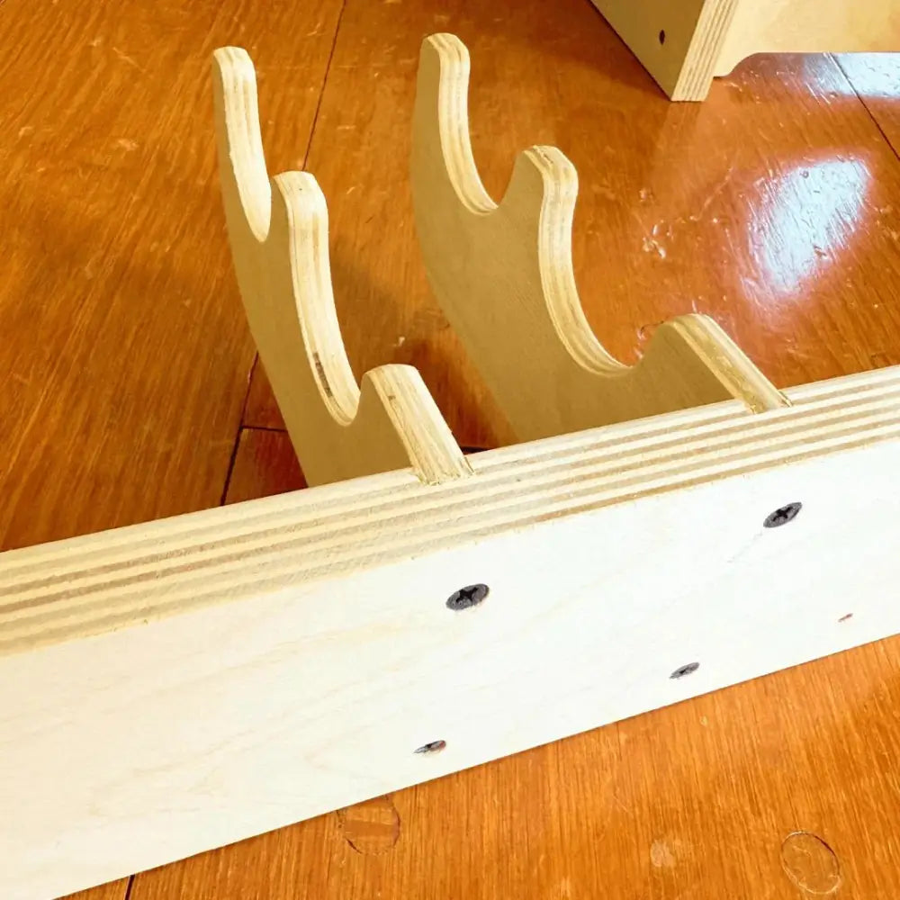 Light-colored birch plywood heavy duty garage wall tool rack with curved deer-like antler-shaped supports