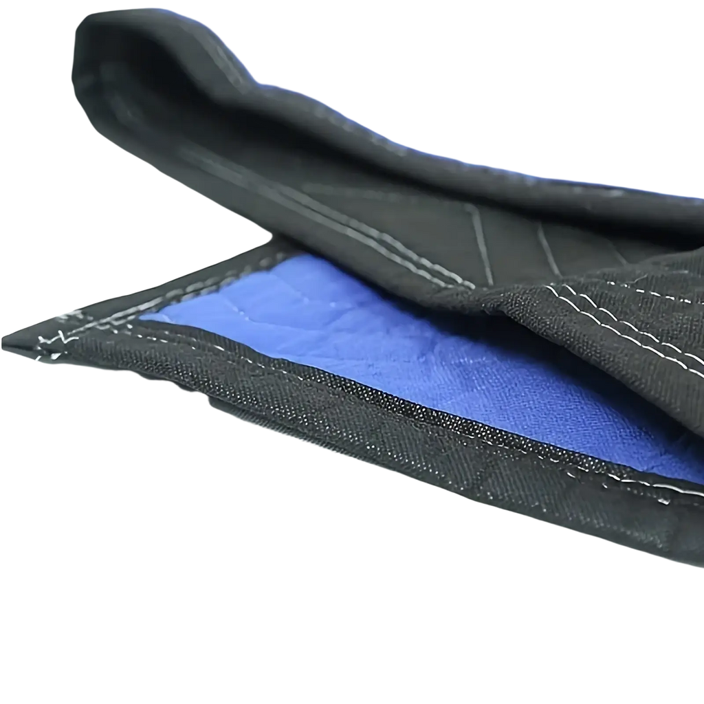 Blue and black quilted heavy duty moving blanket with reinforced stitching for furniture protection