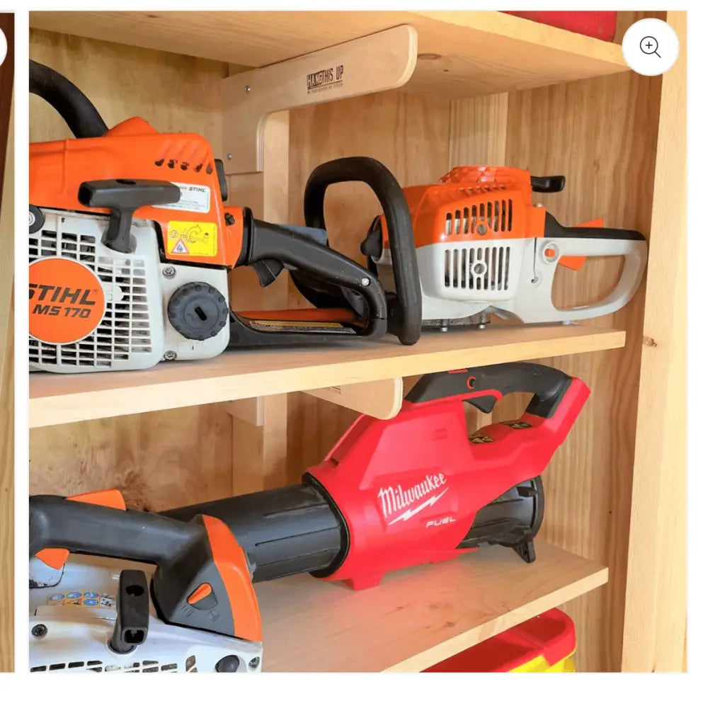 Orange and white Stihl ms 170 chainsaw with black handlebars displayed with hangs up heavy duty wooden shed shelf bracket kit