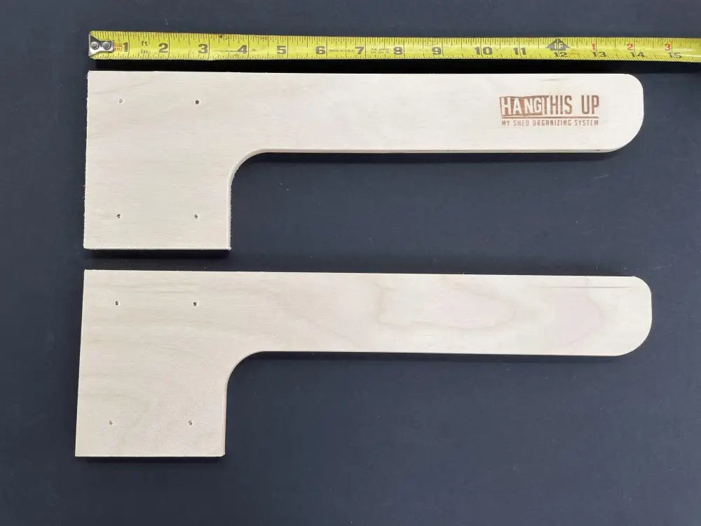 Light-colored wooden l-shaped heavy duty shed shelf brackets with hang this up brand logo engraved on top piece