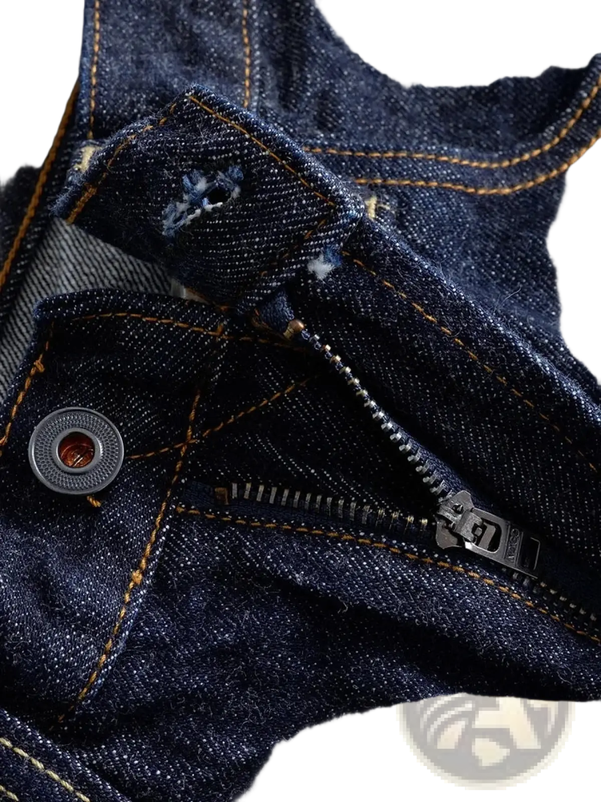 Heavyweight red selvedge denim jeans in dark blue with contrasting yellow stitching and a silver-toned button