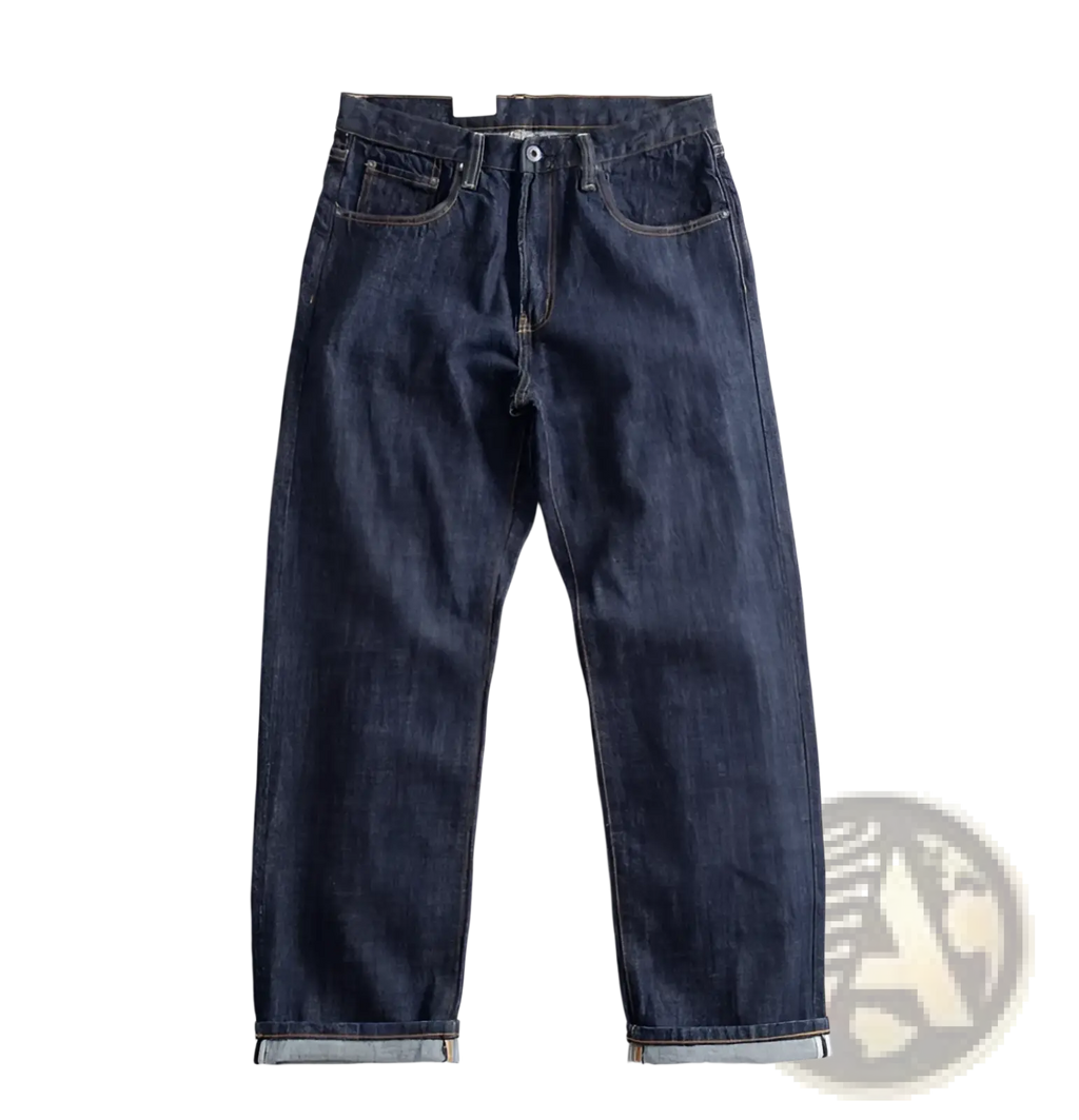 Heavyweight red selvedge denim jeans in dark indigo with classic five-pocket design and rolled cuffs