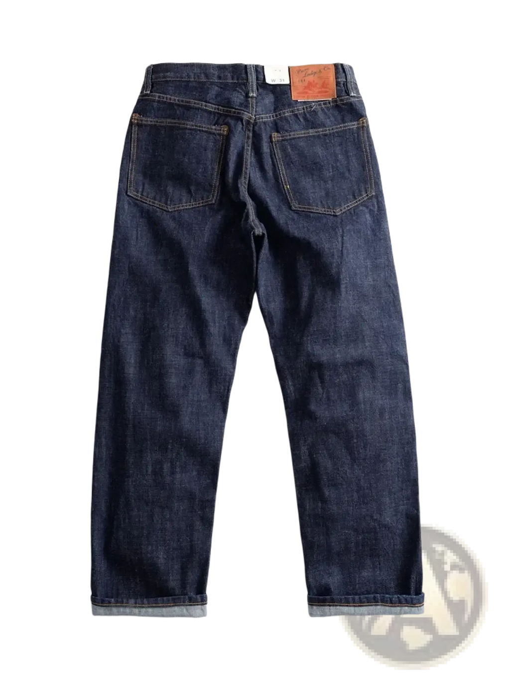 Dark indigo heavyweight red selvedge denim jeans with classic five-pocket design and rolled cuffs