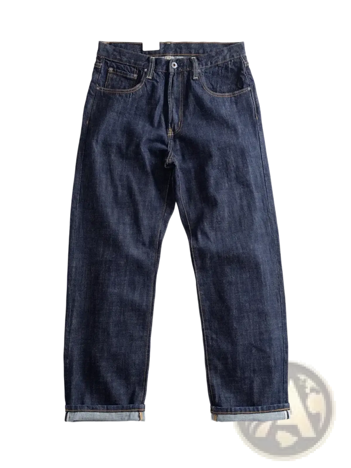 Heavyweight red selvedge denim jeans in dark indigo with classic five-pocket design and rolled cuffs