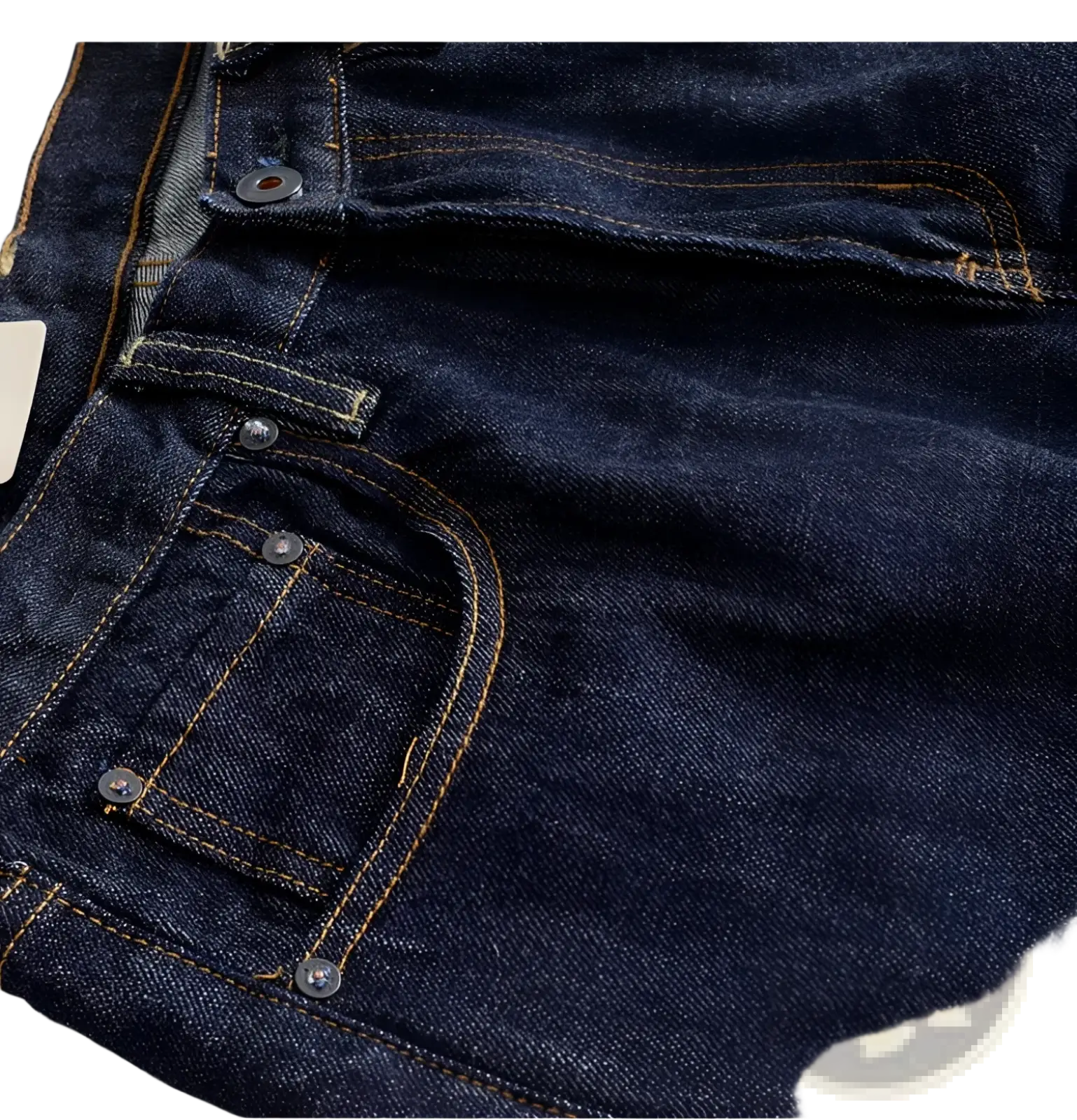 Heavyweight red selvedge denim jeans in dark indigo with contrasting tan stitching and silver metal buttons