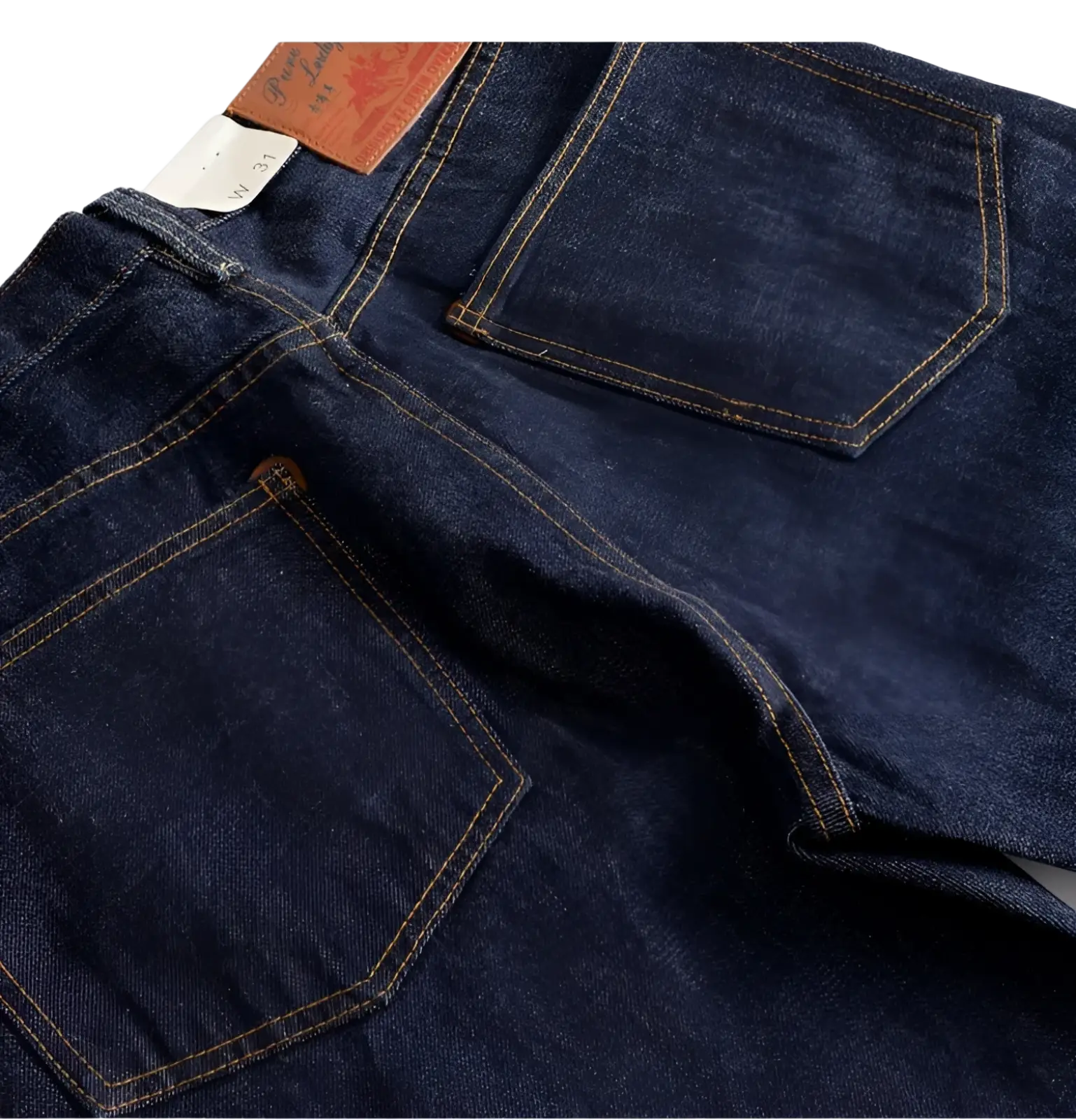 Heavyweight red selvedge denim jeans in dark indigo with tan stitching and brown leather patch on the waistband back side