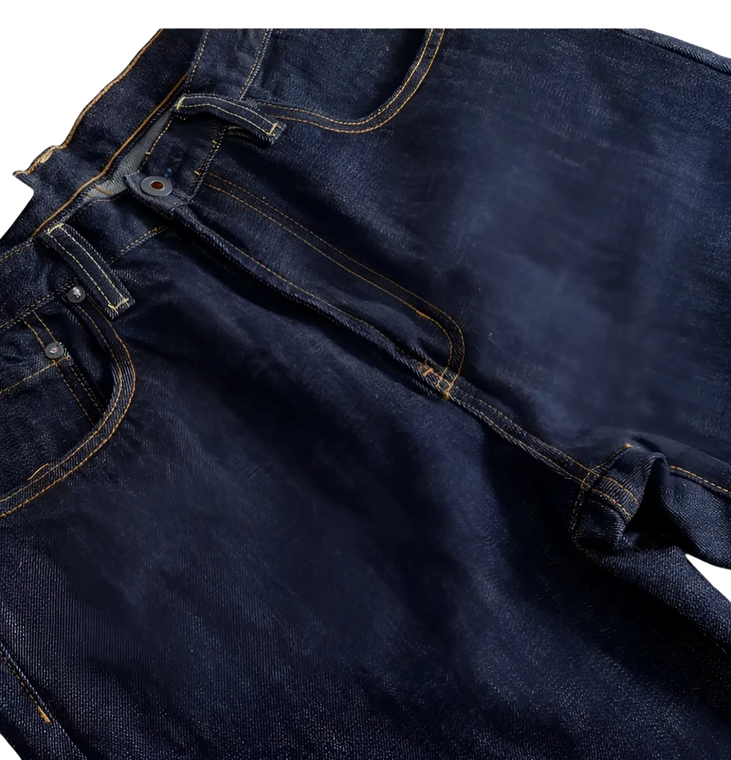 Heavyweight red selvedge denim jeans in dark indigo with contrasting yellow stitching and metal buttons