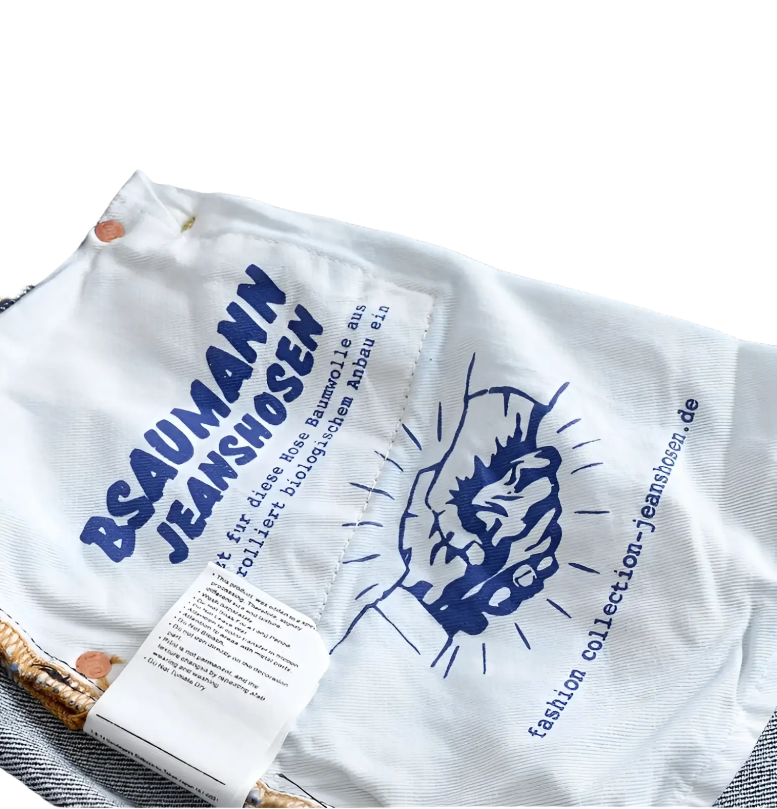 White fabric label on the back of heavyweight red selvedge denim jeans with bsaumann jeanshosen branding and website details