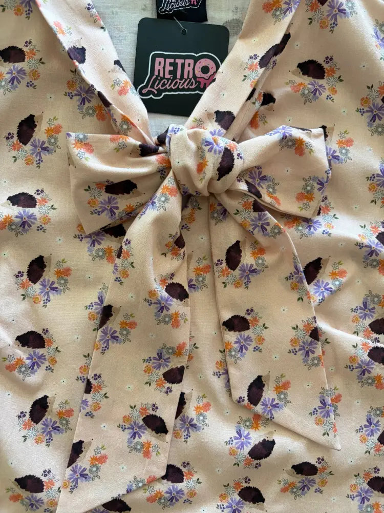 Vintage hedgehog print cotton blouse in cream with purple orange brown floral pattern and fabric bow at the neckline