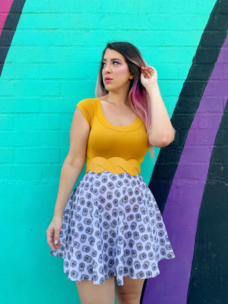 Retro hedgehog print cotton skater skirt in white with black skull pattern paired with mustard yellow top