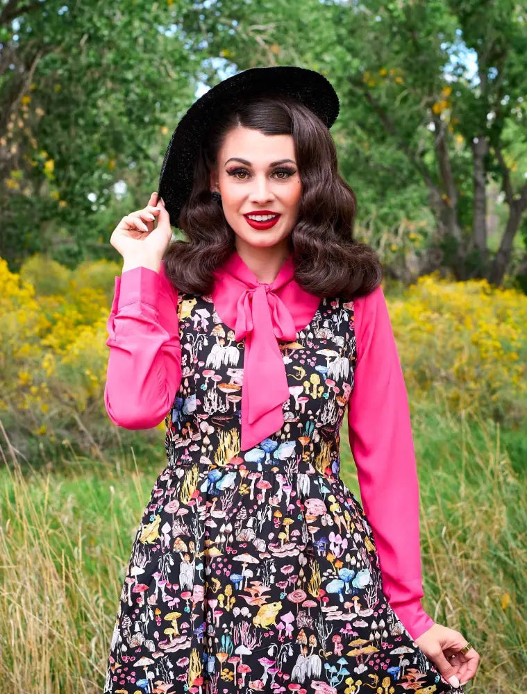 Black dress with colorful mushroom and butterfly print paired with helen pink bow tie retro long sleeve blouse