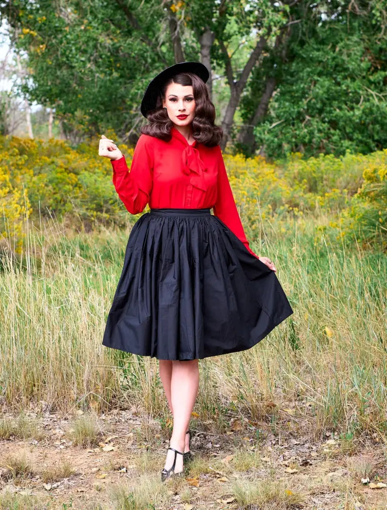 Red long-sleeved plus size blouse with a bow tie neckline, elegant retro style for formal or casual wear