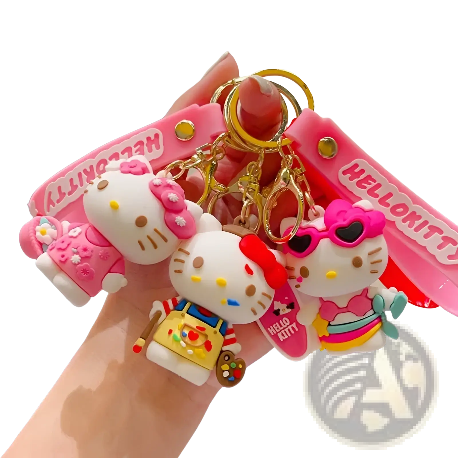 A set of three pink and white hello kitty cartoon keychains with unique outfits like painter apron and sunglasses