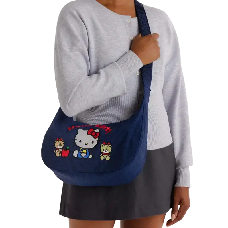 Navy blue hello kitty dumpling crossbody bag with embroidered characters and matching shoulder strap