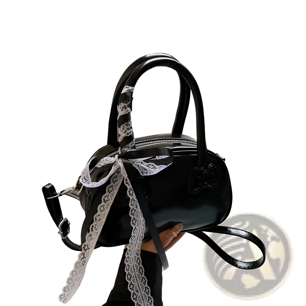 Hello Kitty glossy black lace bow crossbody bag with a bow-shaped handle and white lace ribbon detail